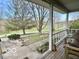 Inviting covered porch with seating, offering a relaxing outdoor space to enjoy the neighborhood view at 5846 Bellsville Pike, Columbus, IN 47201