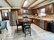 Charming kitchen with wood cabinets, stainless steel appliances, and a dining area at 5846 Bellsville Pike, Columbus, IN 47201