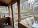 Inviting screened-in porch with a view of the yard and outdoor living space at 5846 Bellsville Pike, Columbus, IN 47201