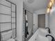 Stylish bathroom featuring a tiled shower, modern fixtures, and a sleek vanity at 609 E Southern Ave, Indianapolis, IN 46203