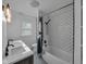 This bathroom offers a tiled shower and double sink vanity with modern fixtures and a mosaic-tiled floor at 609 E Southern Ave, Indianapolis, IN 46203