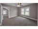 Spacious bedroom with ceiling fan and large windows offering pleasant views at 609 E Southern Ave, Indianapolis, IN 46203