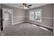 Bright bedroom with large windows, ceiling fan, and closet for storage at 609 E Southern Ave, Indianapolis, IN 46203