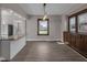 Bright dining room with wooden trim, stylish lighting, and a built-in cabinet at 609 E Southern Ave, Indianapolis, IN 46203