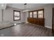 Elegant dining area with modern lighting, built-in wooden cabinet, and large windows at 609 E Southern Ave, Indianapolis, IN 46203