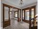 Inviting entryway showcasing beautiful wood trim and a view of the staircase and living area at 609 E Southern Ave, Indianapolis, IN 46203