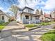 This charming two-story home features a welcoming front porch and a long driveway at 609 E Southern Ave, Indianapolis, IN 46203