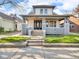 Charming two-story home with inviting front porch and well-maintained lawn at 609 E Southern Ave, Indianapolis, IN 46203
