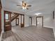 Spacious living room featuring wood trim, modern ceiling fan, and ample natural light at 609 E Southern Ave, Indianapolis, IN 46203