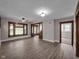 Bright, open-concept living room with wood trim, large windows, and stylish flooring at 609 E Southern Ave, Indianapolis, IN 46203