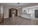 Bright, open-concept living area features hardwood floors and stylish light fixture at 609 E Southern Ave, Indianapolis, IN 46203