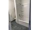 Clean bathroom with a white shower-tub combo, toilet, and tiled floors, providing a functional space at 613 Rahkewood Dr, Indianapolis, IN 46217