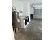 An unfinished garage features modern appliances at 613 Rahkewood Dr, Indianapolis, IN 46217