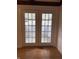 A sunroom features bright, natural light and tile flooring at 613 Rahkewood Dr, Indianapolis, IN 46217