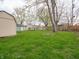 Expansive green backyard featuring healthy grass, a shed, and mature shade trees at 6189 Vigo Dr, Clayton, IN 46118