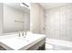 Bathroom vanity featuring modern fixtures, mirror and tiled shower at 6189 Vigo Dr, Clayton, IN 46118