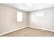 Bedroom featuring neutral walls, carpet, and two windows at 6189 Vigo Dr, Clayton, IN 46118