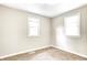Bedroom featuring neutral walls, carpet, and two windows at 6189 Vigo Dr, Clayton, IN 46118