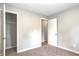 Bedroom with neutral paint, carpet, and a closet at 6189 Vigo Dr, Clayton, IN 46118