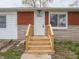 Inviting front entrance with new wooden steps leading to the front door of the home at 6189 Vigo Dr, Clayton, IN 46118