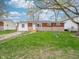 Charming red brick home featuring a well maintained lawn and an ADT security sign at 6189 Vigo Dr, Clayton, IN 46118