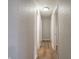 This hallway features wood-look floors and textured walls at 6189 Vigo Dr, Clayton, IN 46118
