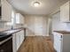 Updated kitchen features white cabinets, wood countertops, and stainless steel appliances at 6189 Vigo Dr, Clayton, IN 46118
