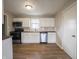 The kitchen features sleek, stainless steel appliances and ample cabinet space at 6189 Vigo Dr, Clayton, IN 46118