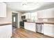 Bright kitchen featuring white cabinets, stainless steel appliances, and butcher block countertops at 6189 Vigo Dr, Clayton, IN 46118