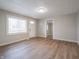 Bright living room with new laminate floors, natural light and freshly painted walls at 6189 Vigo Dr, Clayton, IN 46118