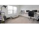 Bright bedroom featuring a work space with natural light and neutral decor at 6323 Emerald Field Way, Indianapolis, IN 46221