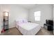 Bright bedroom featuring neutral carpet and walls, plus simple furnishings at 6323 Emerald Field Way, Indianapolis, IN 46221