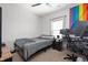 Bedroom with neutral carpet and walls, decorated with simple furnishings, and natural light at 6323 Emerald Field Way, Indianapolis, IN 46221