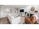 Open-concept living room featuring a cozy fireplace and ample seating at 6323 Emerald Field Way, Indianapolis, IN 46221