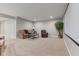 Comfortable basement area with plush seating and a large projector screen at 6841 W Glory Maple Dr, McCordsville, IN 46055