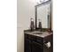 Bathroom featuring a dark vanity with mirror and drawers, complete with a brown hand towel at 6841 W Glory Maple Dr, McCordsville, IN 46055