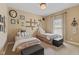 Bright, cheerful bedroom with twin beds, carpet, and fun decor at 6841 W Glory Maple Dr, McCordsville, IN 46055