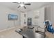 Home office/bedroom featuring a ceiling fan, desk, and walk-in closet at 6841 W Glory Maple Dr, McCordsville, IN 46055