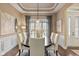 Inviting dining room with dark hardwood floors, a modern chandelier, and a dining table for eight at 6841 W Glory Maple Dr, McCordsville, IN 46055