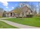Charming brick home with a well-maintained lawn and lovely landscaping creating great curb appeal at 6841 W Glory Maple Dr, McCordsville, IN 46055