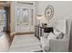 Elegant foyer featuring stylish decor, a decorative table, and a sophisticated armchair at 6841 W Glory Maple Dr, McCordsville, IN 46055