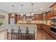 Spacious kitchen with a large island, stainless steel appliances, and beautiful pendant lighting at 6841 W Glory Maple Dr, McCordsville, IN 46055