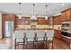 Gourmet kitchen with a large center island, granite countertops, and modern stainless steel appliances at 6841 W Glory Maple Dr, McCordsville, IN 46055