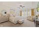 Serene main bedroom features plush carpeting, a seating area, and large windows with natural light at 6841 W Glory Maple Dr, McCordsville, IN 46055