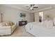 Cozy main bedroom with a ceiling fan, sitting area, tv, and plush carpet for a comfortable feel at 6841 W Glory Maple Dr, McCordsville, IN 46055