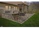 Outdoor dining area with a built-in kitchen and seating, perfect for entertaining at 6841 W Glory Maple Dr, McCordsville, IN 46055