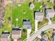 Aerial view of a home with a spacious backyard, a fire pit and a detached shed at 7354 Ponderosa Pines Ln, Indianapolis, IN 46239