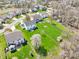 Aerial view of the home featuring a spacious backyard, a detached shed and mature trees at 7354 Ponderosa Pines Ln, Indianapolis, IN 46239