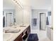 Bathroom featuring dual sinks, generous counter space, and classic vanity at 7354 Ponderosa Pines Ln, Indianapolis, IN 46239
