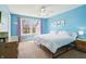 Bright bedroom with a large window and plenty of natural light, freshly painted with carpet floor at 7354 Ponderosa Pines Ln, Indianapolis, IN 46239